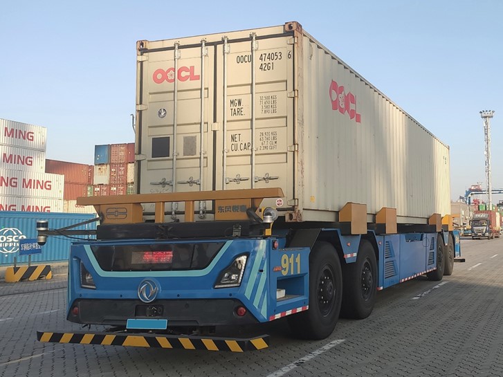 Autonomous tractor at shipping terminal